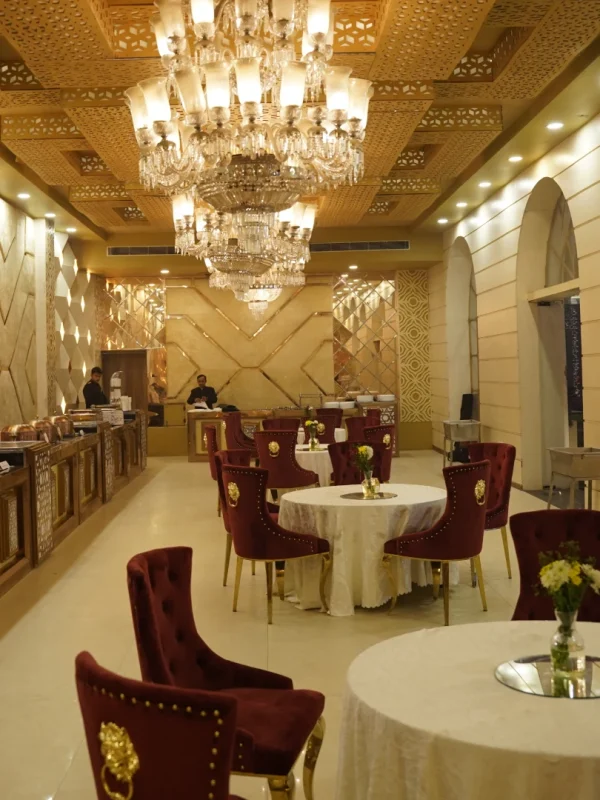 Luxury banquet hall in Gurgaon with elegant chandeliers and royal seating